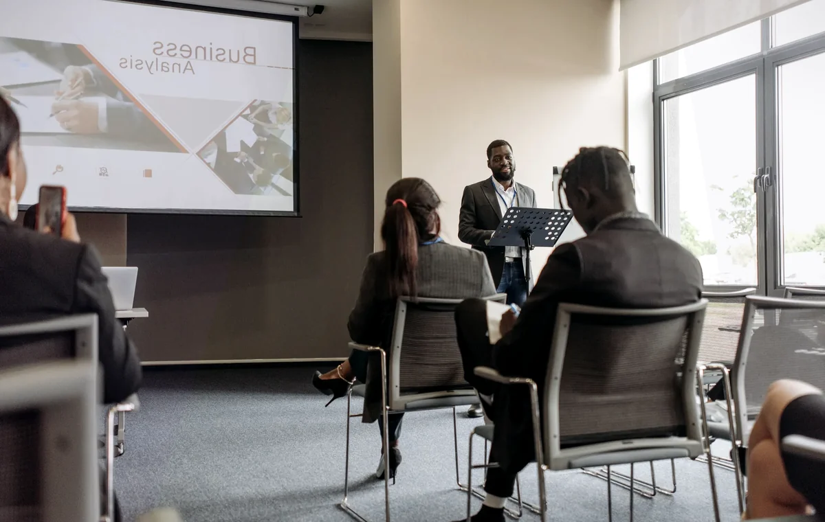 Professionals reviewing a meeting plan